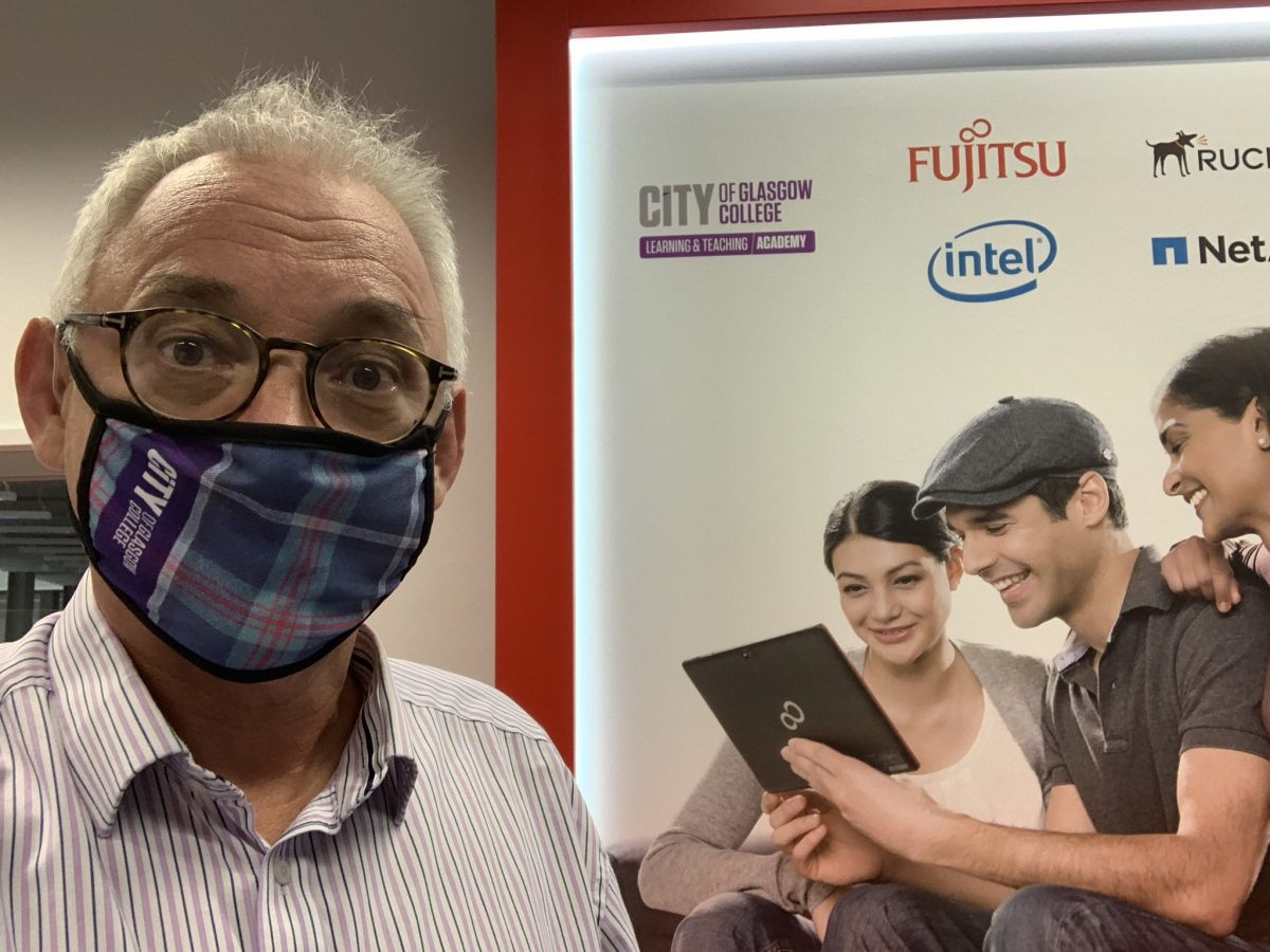 Image of Joe Wilson with Fujitsu Learning Hub in background